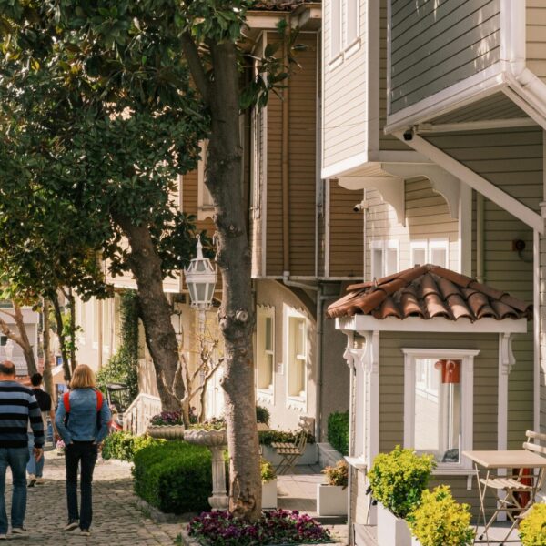 A picturesque residential street with classic architecture and vibrant greenery, perfect for a peaceful stroll.